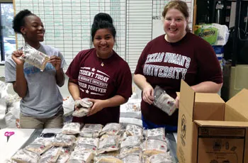 Students boxing up goods